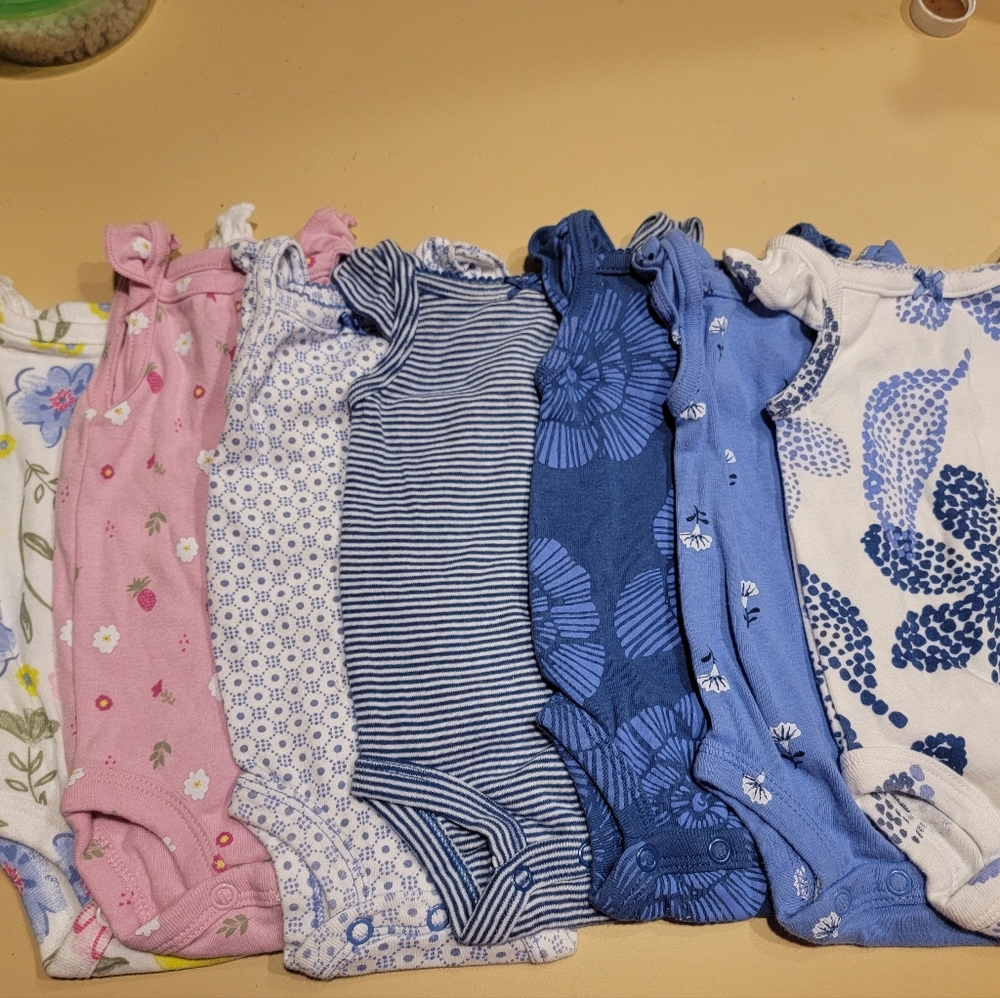 7 Carter's Newborn one piece outfits. Floral & stripes